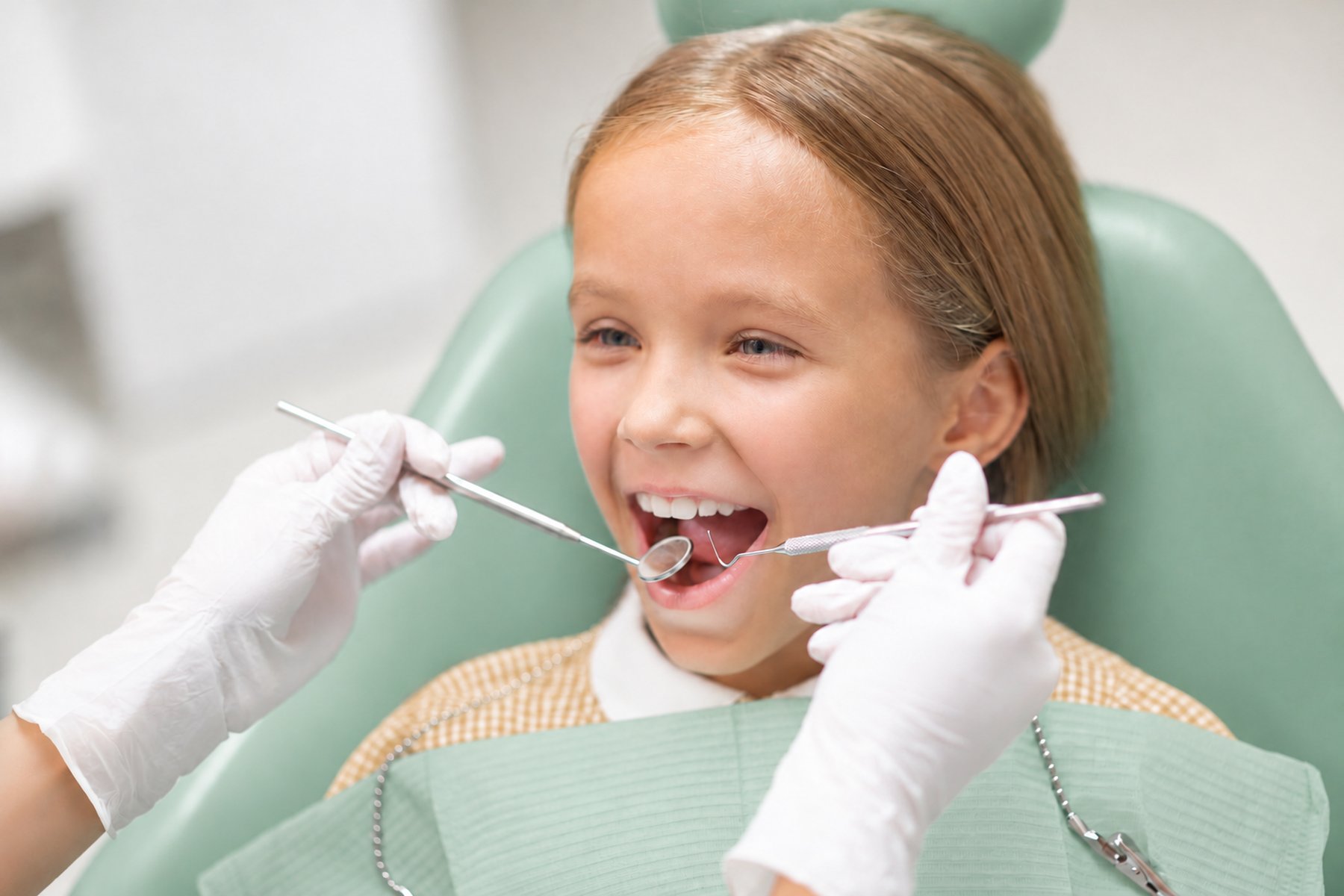 Happy young patient at the dentist
